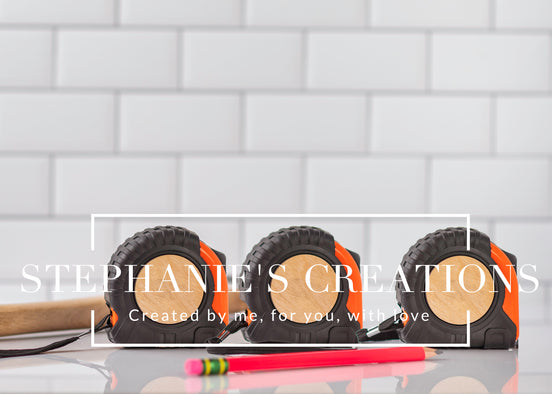 Three blank tape measures with wood engraving areas, styled on a clean tile background, ideal for custom product mockups.