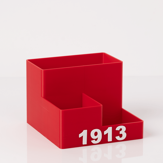 DST 1913 crimson red 3D printed desk organizer with raised lettering on white background