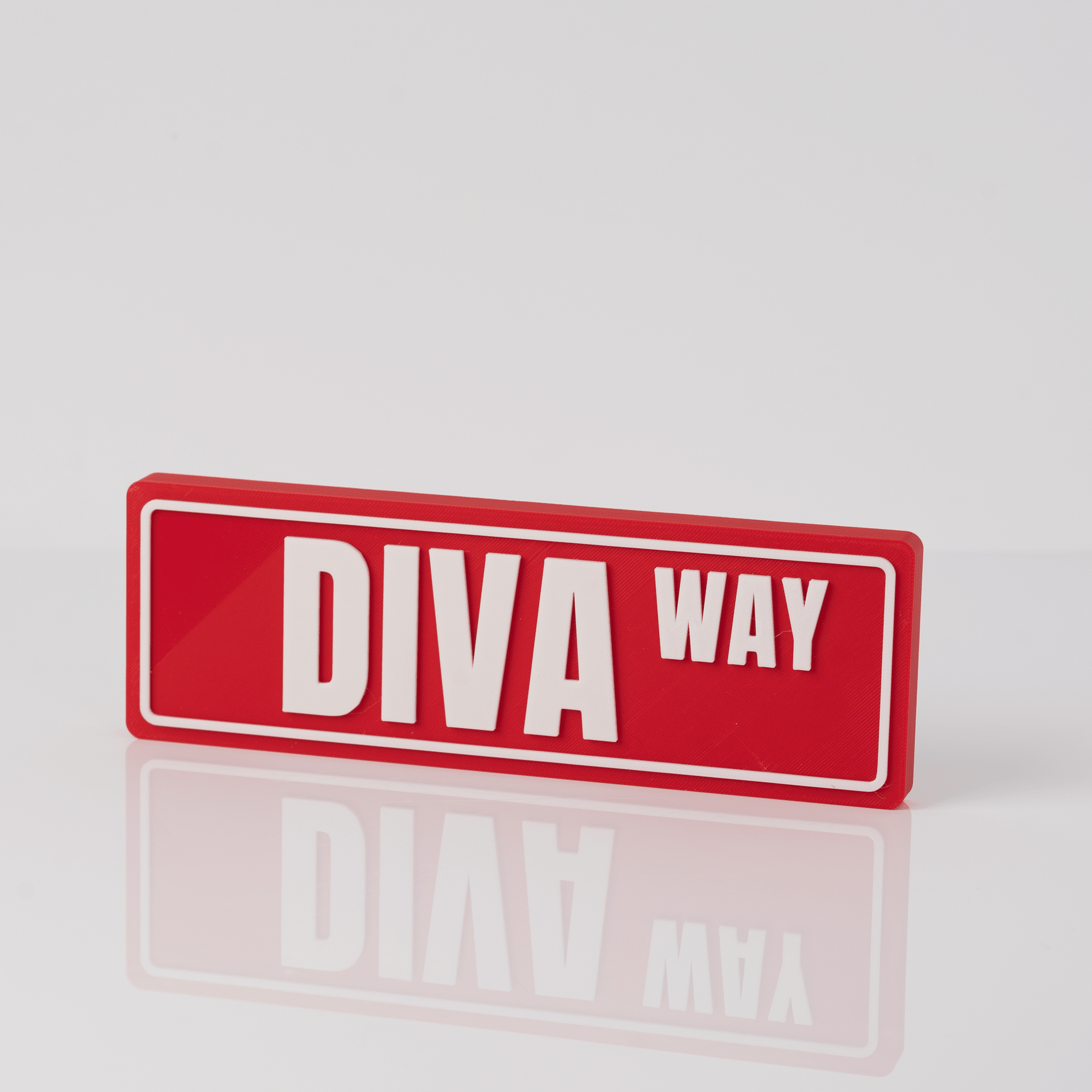 3D printed Delta Sigma Theta street sign desk display in crimson and white with reflection
