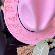 Engraved wide-brim fedora with belt buckle and custom band