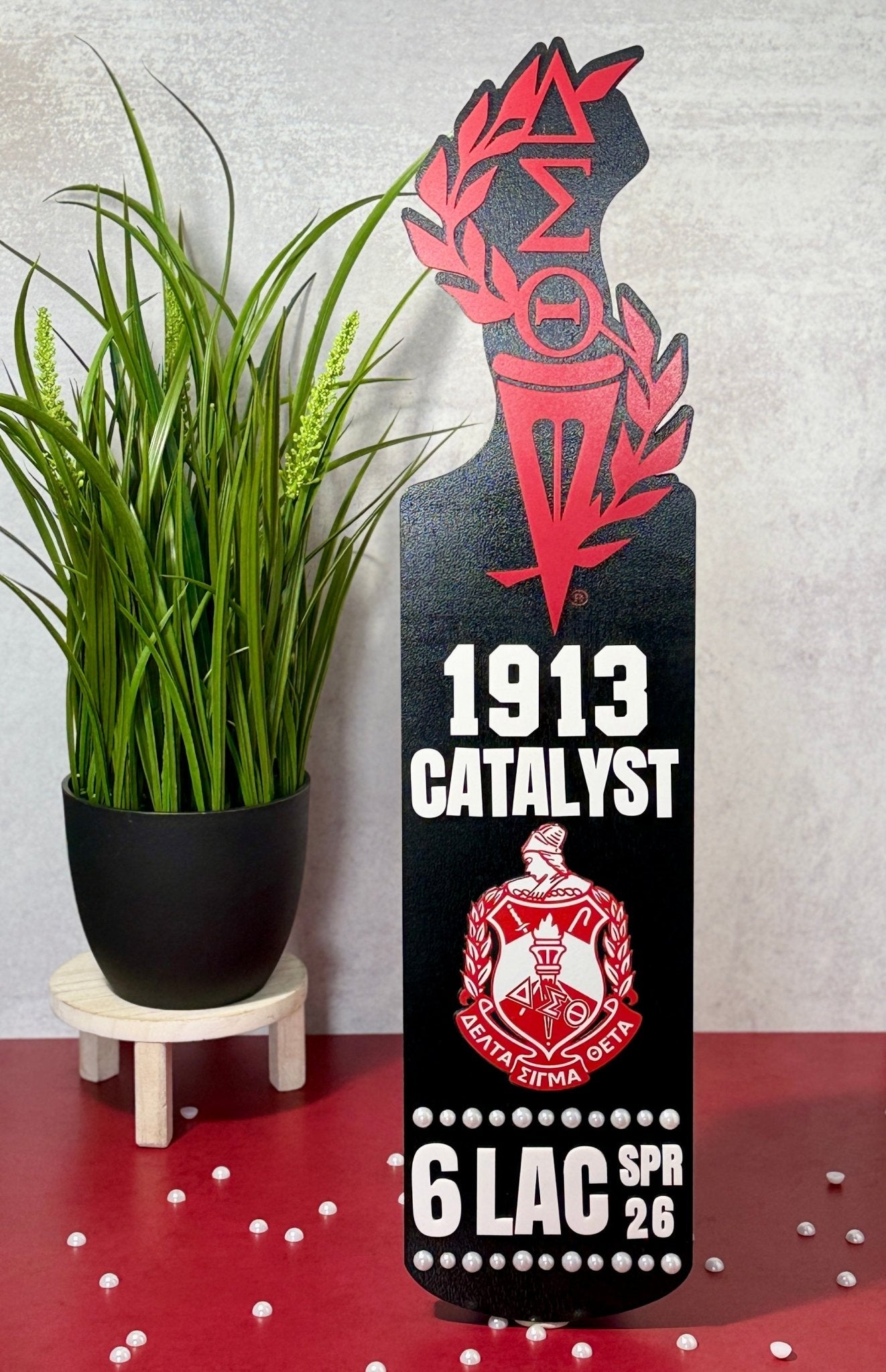 Personalized Delta Sigma Theta display paddle in layered wood and acrylic crimson and black