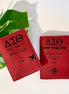 Two personalized DST laser engraved passport holders in crimson leatherette with Greek letters and travel design