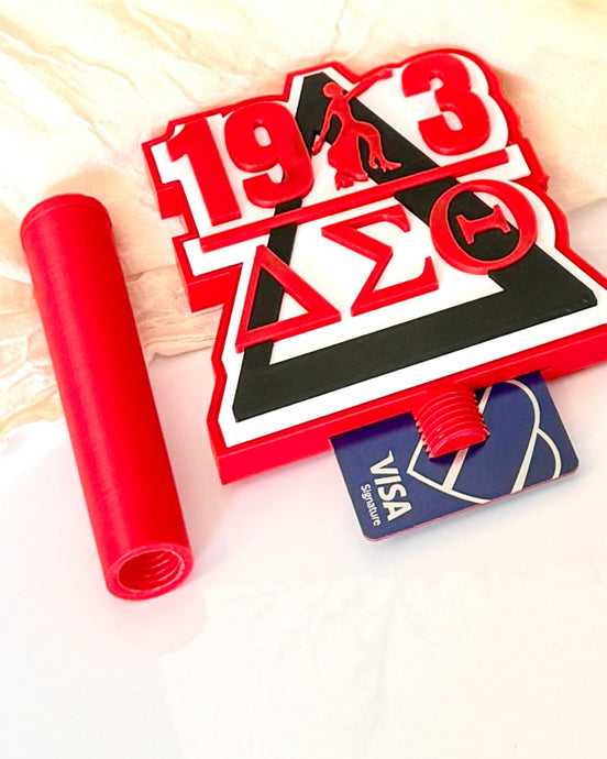 Delta Sigma Theta 3D printed tap-to-pay wand and card holder topper displayed with credit card showing card slot, licensed DST sorority gift in crimson red and black
