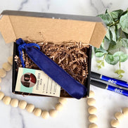 Open gift box showing blue pen pouch and business card, ready for Phi Beta Sigma order shipment