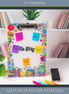 Personalized UV printed teacher clipboard with colorful classroom design and custom name, displayed on a white desk as a teacher appreciation gift