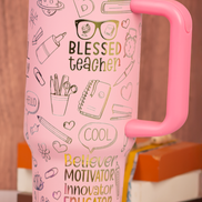 Engraved tumbler with “Blessed Teacher” and school icons in rainbow colors