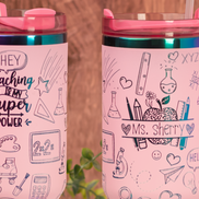Custom tumbler with teacher’s name engraved among school doodles