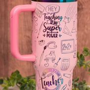 Closeup of “Teaching is my Superpower” engraved on pink tumbler